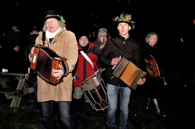 Folk musicians entertain the revellers.