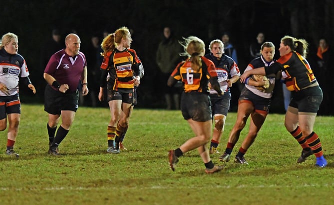 Wivey Ladies in action, left to right: Lauryn Bristow, Chloe Stone, Jasmine Greenway, Hattie Trollope-Bellew, Maisie Brammell (ball carrier), Summer Constance, and Jess Weaver.