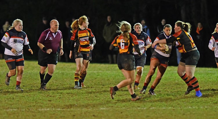 Wivey Ladies in action, left to right: Lauryn Bristow, Chloe Stone, Jasmine Greenway, Hattie Trollope-Bellew, Maisie Brammell (ball carrier), Summer Constance, and Jess Weaver.