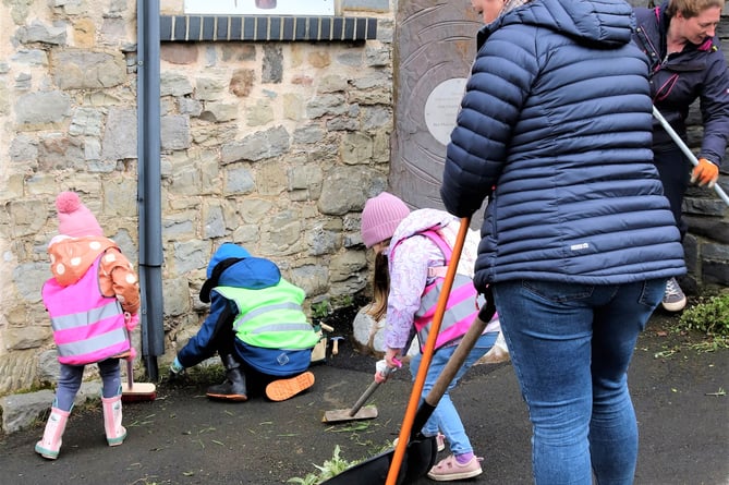 Youngsters join in the clean-up at Watchet