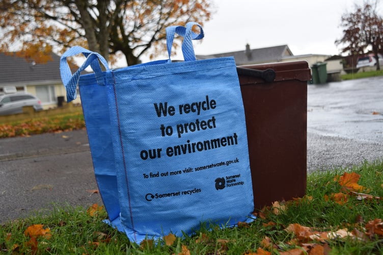 A Bright Blue Bag And Food Waste Caddy Ready For Kerbside Collection. 