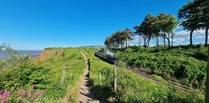 Take part in organised coastal walk admiring beauty of Exmoor