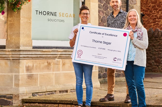 Receiving a Cancer Research UK certificate of excellence are (left to right) Thorne Segar's Becky Padgett, Iestyn Milton Jenkins, and Tina Cook.