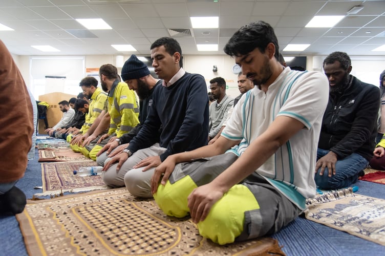 Hinkley Point C workers from the Muslim faith taking part in Friday prayers.