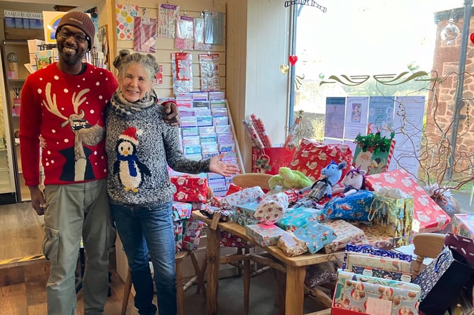 Christmas gifts from Wootton Courtenay residents were collected in the village Post Office and shop and handed to Home-Start West Somerset by store managers Mark Burgess and Sarah Fox.