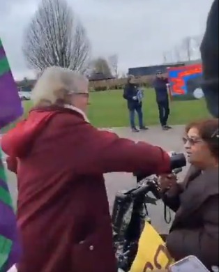 Watchet Cllr Rosemary Woods (left) is confronted by protester Tasleem Haysham outside Somerset Council's budget meeting.