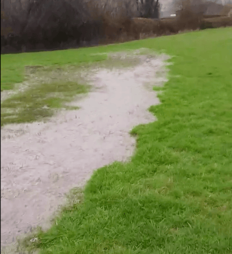 Sewage can be seen flowing through a field in Timberscombe and toward the River Avill.