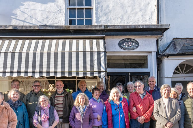 Some of the volunteers who run Stogumber's shop and Post Office after a celebratory cake and tea meeting for their first anniversary.