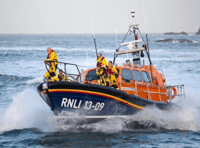 RNLI 200th anniversary scroll being delivered by sea