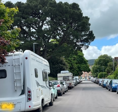 A number of motorhomes can be seen parked along Blenheim Road, Minehead.