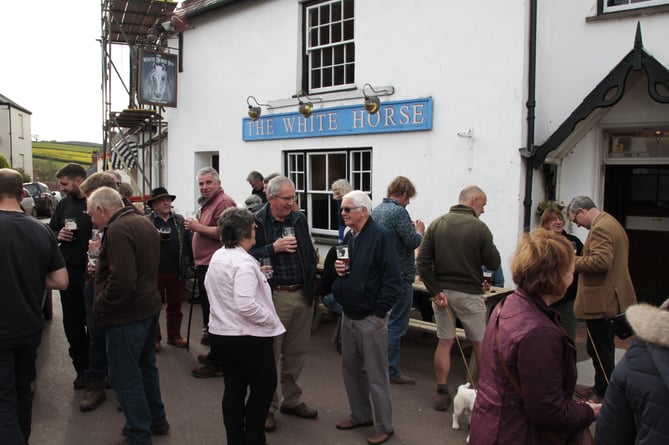 Villagers attending the reopening of the White Horse Inn, Stogumber.