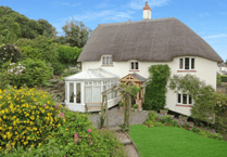 Look inside this characterful thatched former village post office in Withycombe