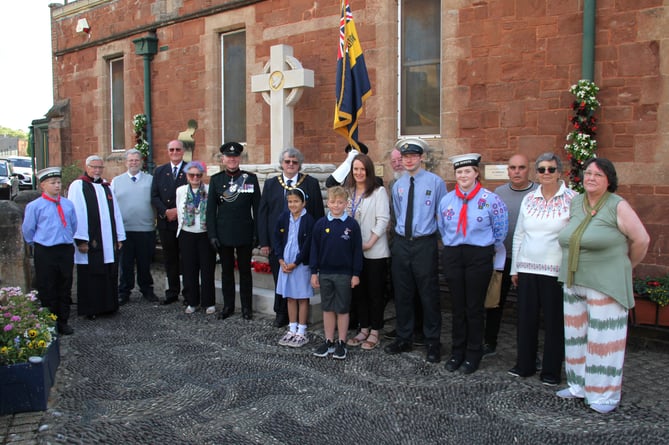 Attending the 10th anniversary service of Watchet War Memorial are (left to right) Sea Scout Samuel Olsansky, Deacon Vincent Woods, Martyn Summers, Maj Robert Macdonald, Watchet Mayor Loretta Whetlor, Dep Lord Lieut Brigadier Richard Toomey, Somerset Council chairman Cllr Mike Best, Knights Templar pupils Deanna Tipper, Mackenzie Lever, and Laura Weaver, Sea Scouts Tommy Dibble and Becky Cottrell, and trustees Norman Yaw, Jean Macdonald, and Tina Yaw.