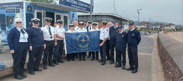 National Coastwatch Institution's 30th anniversary flag reaches the Minehead station on its relay journey around the coast of England and Wales.