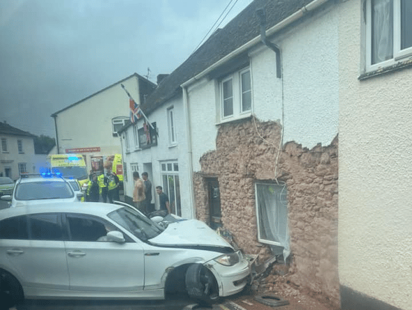 Emergency services attending the scene where a car crashed into a house in Williton. PHOTO: Gosia Ollerenshaw.