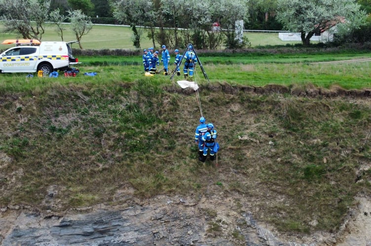 A Coastguard cliff rescue team in action.