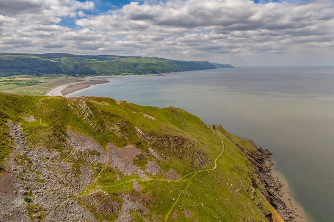 An aerial view of the zigzag descent to the Hurlstone Coastguard Lookout on the rugged section of the South West Coast Path between Minehead and Porlock. 