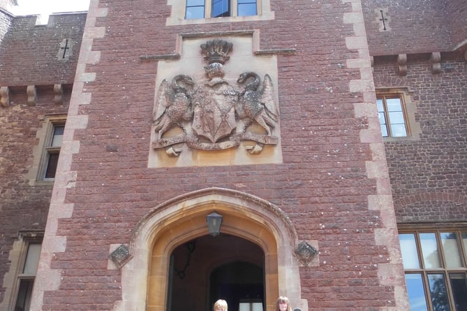 Three 'time capsules' being returned to Dunster Castle by pupils of Dunster First School.