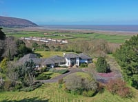 "Impressive" home for sale has ornamental lake and panoramic sea views