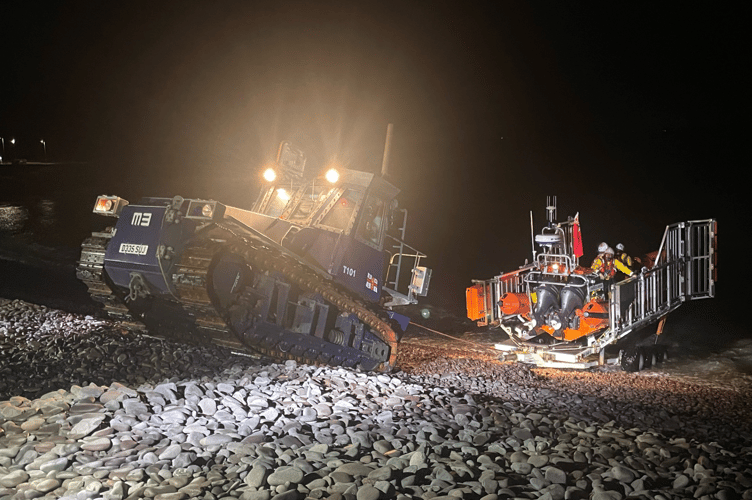 Minehead RNLI crew in action during the rescue operation near Watchet Harbour.