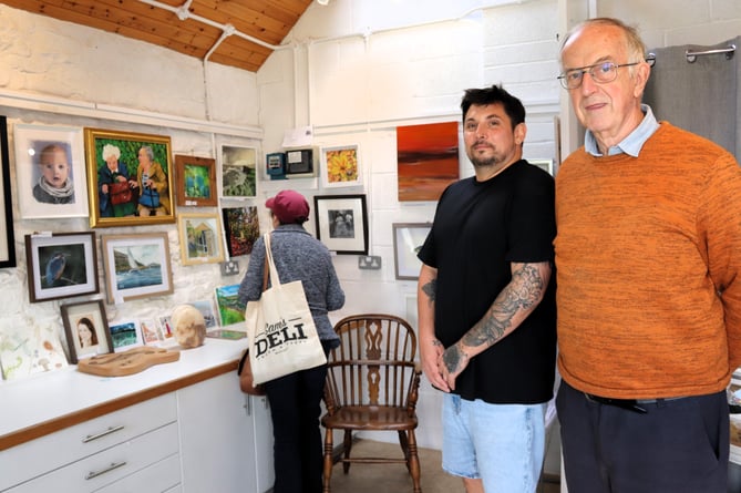 Watchet Conservation Society Chairman Rob Hutchings (right) and town councillor Sean Terrett admire the entries at the Mayfly gallery (Photo Terry Walker)