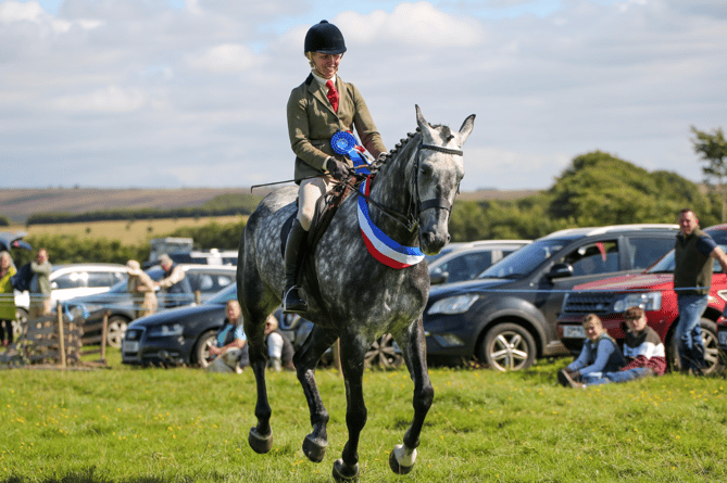 Winner of the Fortesque Cup for Supreme Champion - Laura Jones rides her seven year old gelding Staghall Boby