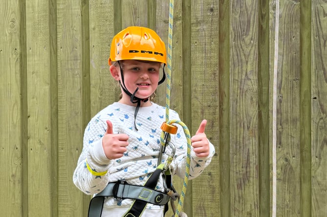 One of the youngsters who abseiled at the Open Day.  AQ 1995
