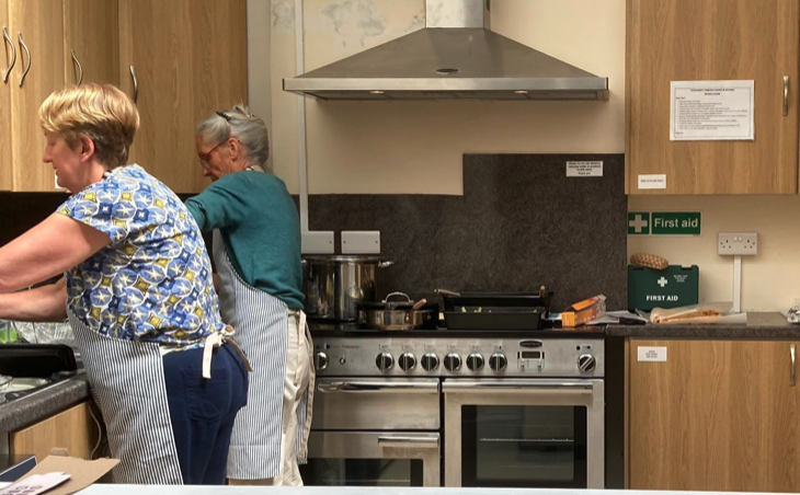 Volunteer cooks prepare a meal for Stogursey Lunches when the group still used the vllage's Church Rooms.