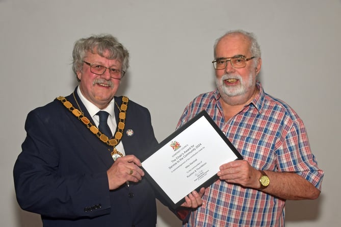 Mike Marshall receiving his award from Somerset Council Chair, Cllr Mike Best.