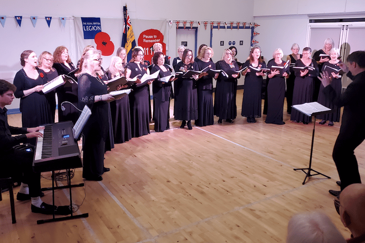 The Military Wives Choir, Taunton, with conductor Edward Goater and accompanist Sam Baker, performing in The Pavilon, Williton. PHOTO Guy Morgan.