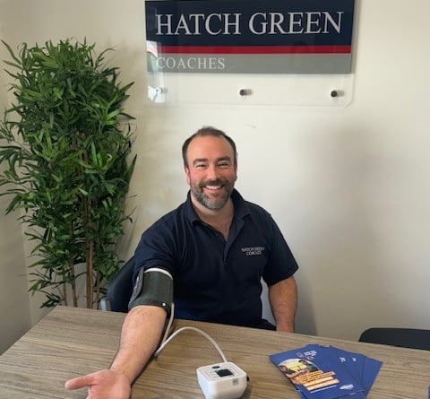 Joshua Strickland, operations director at Hatch Green Coaches, having his blood pressure taken