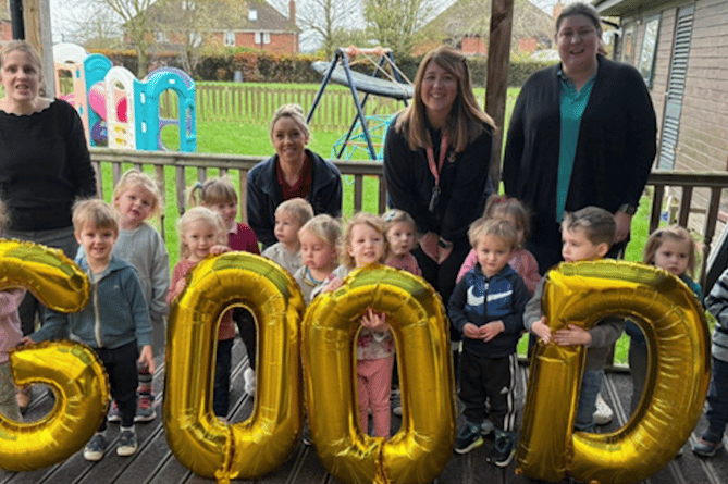 Some of the youngest pupils of Knights Templar School, Watchet, join staff in marking a 'good' Ofsted rating.