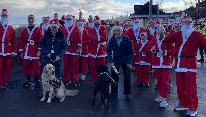 A host of Santas lining up ahead of the annual Minehead Rotary Christmas fun run in aid of Guide Dogs.