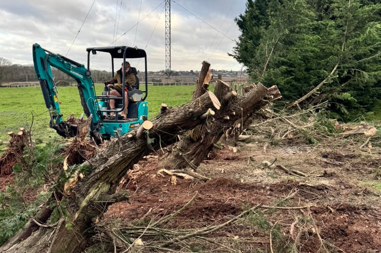 Volunteers help repair storm damage suffered by Tropiquaria Zoo.