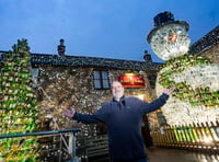 Britain's most festive pub is homed to 26-foot snowman - video