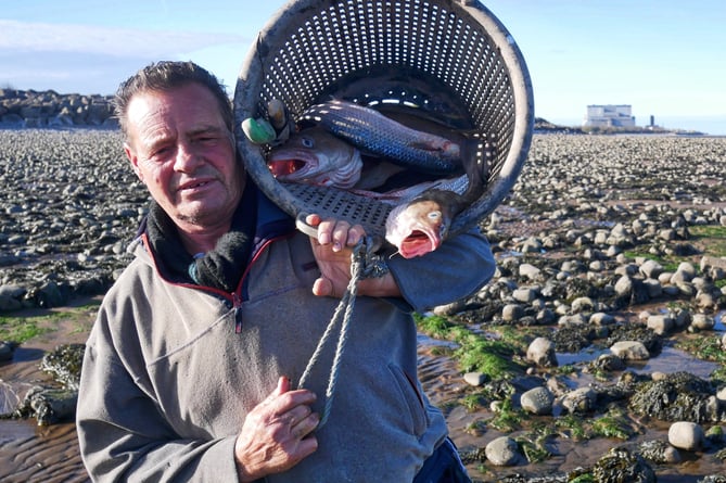 Adrian Sellick heading home with a catch of fish. PHOTO: Martin Hesp.