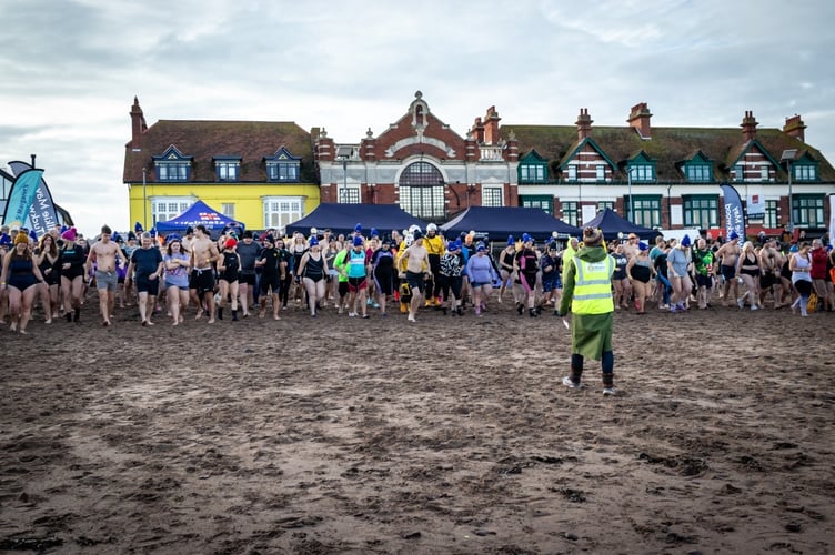 Swimmers line-up for the start of last year's St Margaret's Hospice charity New Year's Day dip.